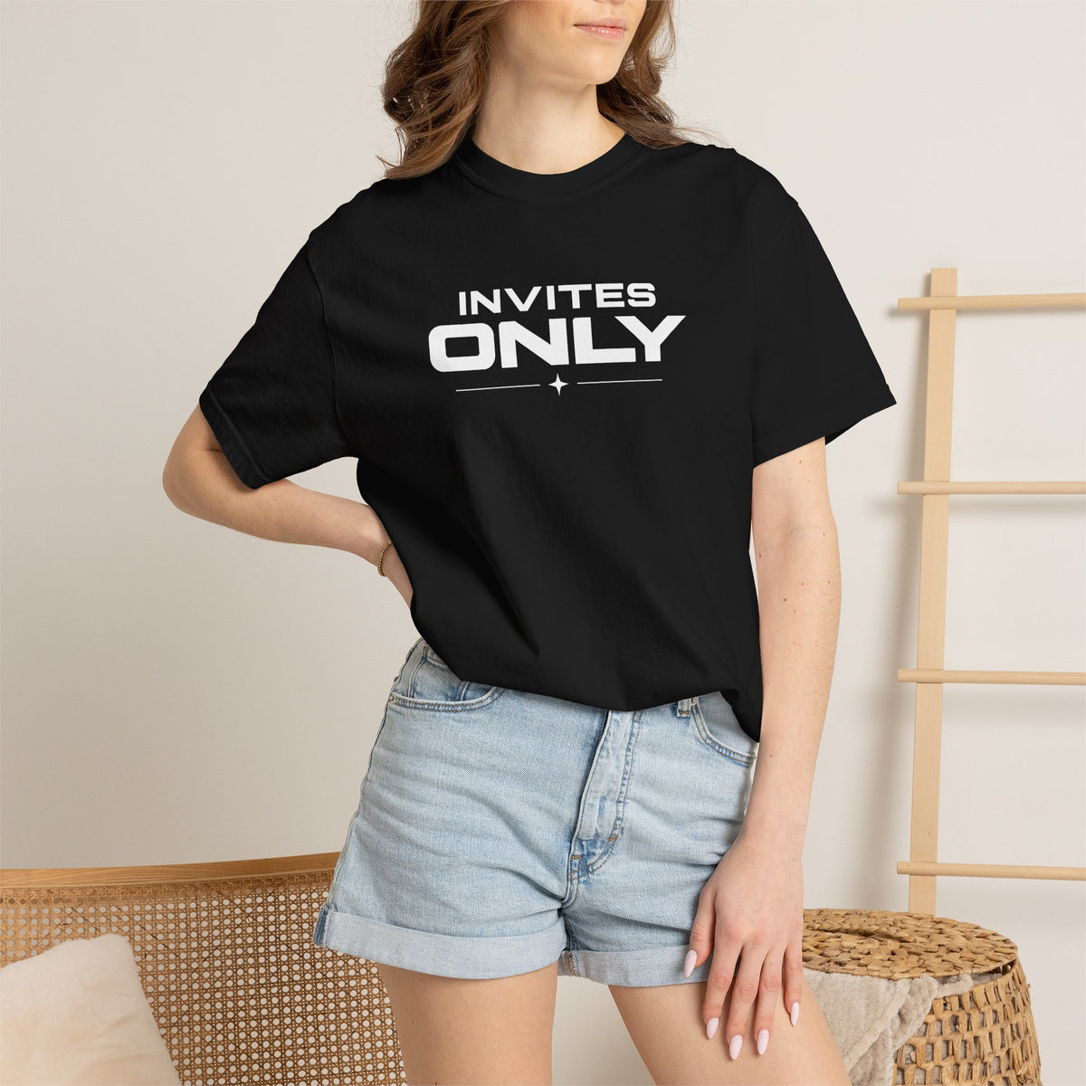 Black crew-neck T-shirt with 'INVITES ONLY' logo, worn
