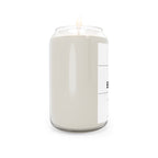 Soy candle in clear jar with flame, off-white wax, label partially visible