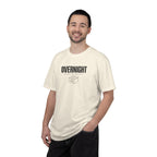 Ivory crew-neck T-shirt with “OVERNIGHT PARTS DEPT.” front graphic