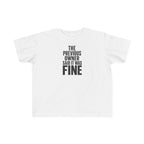 White toddler graphic t-shirt with centered "THE PREVIOUS OWNER SAID IT WAS FINE" text
