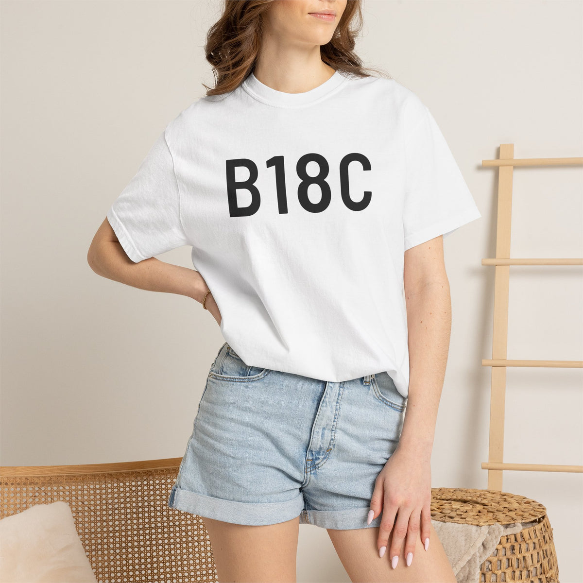 White T-shirt on model with large black “B18C” chest print and crew neck