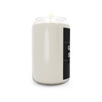 Off-white soy candle in clear glass jar with black side label and burning wick