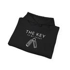 Black hoodie folded flat with “THE KEY TO MY HEART” logo and key graphic on front
