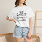 White T-shirt with 'I'm in Danger' logo graphic, worn with light denim shorts