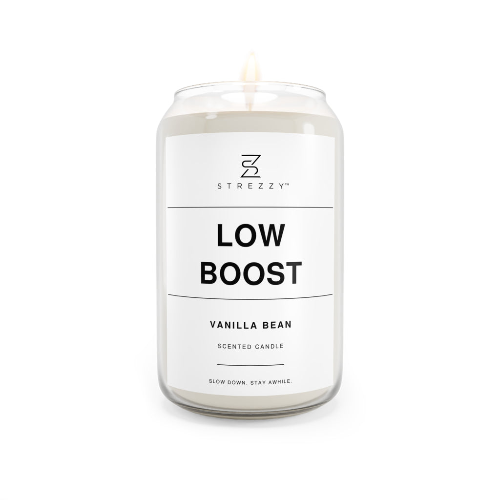 Soy candle in clear jar with flame, Low Boost Vanilla Bean label