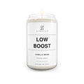 Soy candle in clear jar with flame, Low Boost Vanilla Bean label