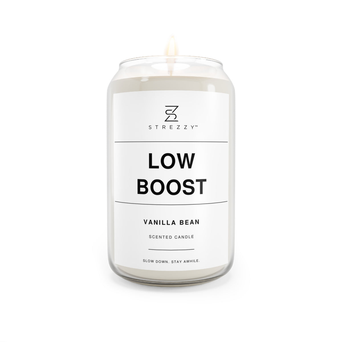 Soy candle in clear jar with flame, Low Boost Vanilla Bean label