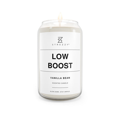 Soy candle in clear jar with flame, Low Boost Vanilla Bean label