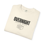 Ivory crew-neck T-shirt with “OVERNIGHT” front box-style graphic