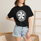 Black crew-neck T-shirt with circular wheel logo print, worn with denim shorts
