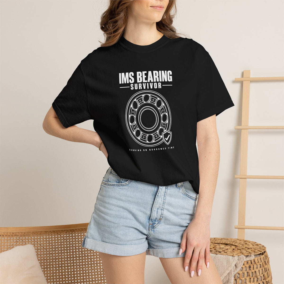 Black crew-neck T-shirt on model with front 'IMS BEARING' wheel logo