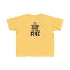 Butter yellow toddler graphic t-shirt with centered text "THE PREVIOUS OWNER SAID IT WAS FINE"