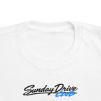 White toddler T-shirt neckline with “Sunday Drive Club” logo close-up