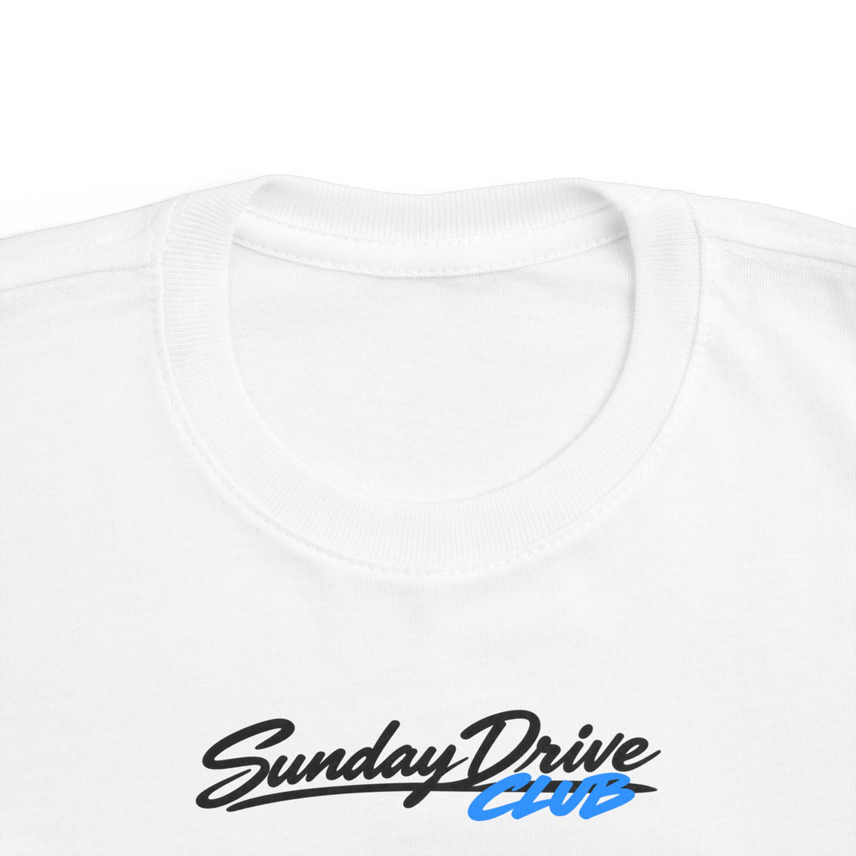 White toddler T-shirt neckline with “Sunday Drive Club” logo close-up