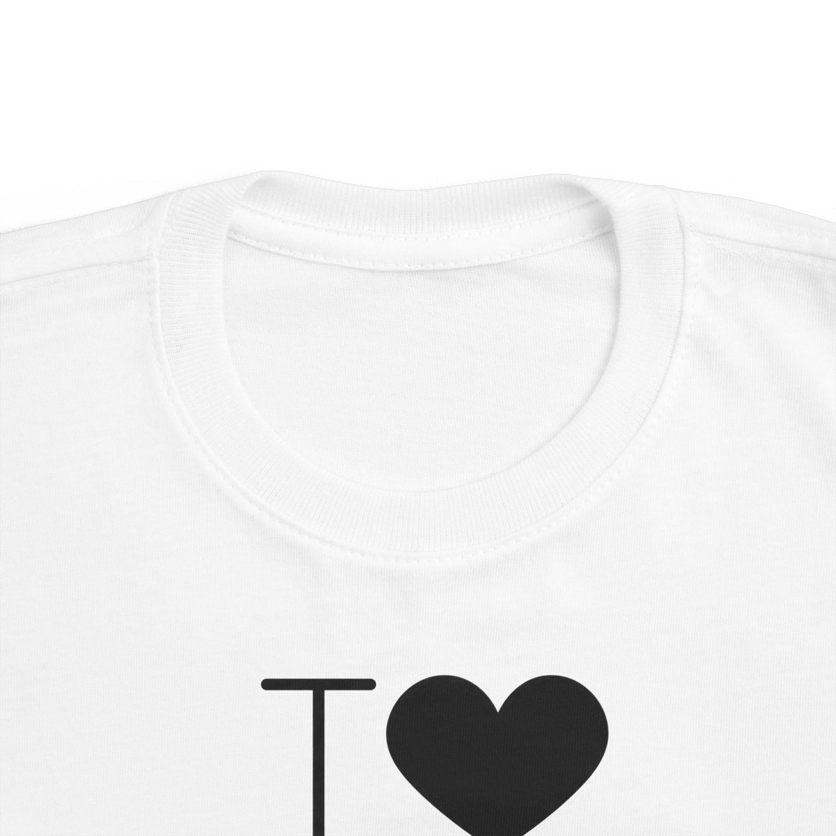 White toddler T-shirt close-up: crew neck and “I ♥” heart chest graphic