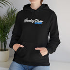 Black pullover hoodie worn by model, embroidered chest logo and kangaroo pocket