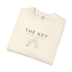Ivory crew-neck T-shirt with car key graphic and THE KEY text