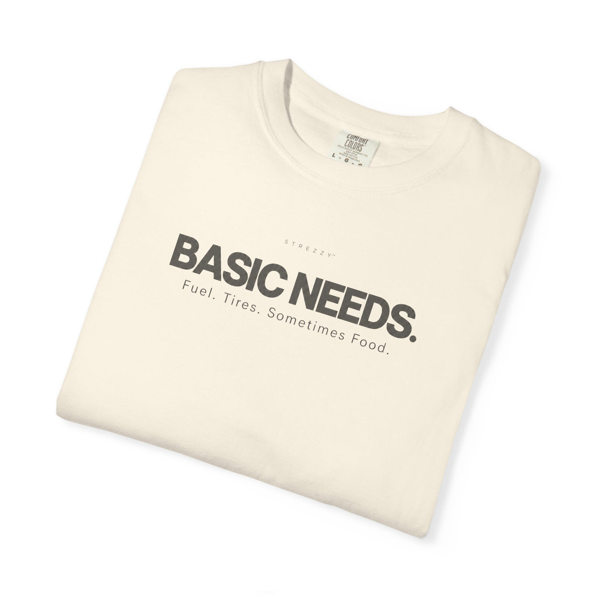 Ivory crewneck T-shirt with 'BASIC NEEDS' graphic logo and tagline