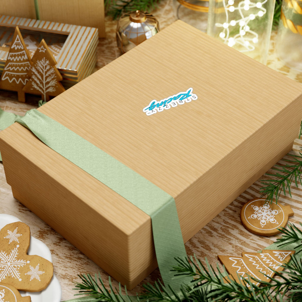 Kiss-cut racing logo sticker on gift box, small teal “Kaching” script