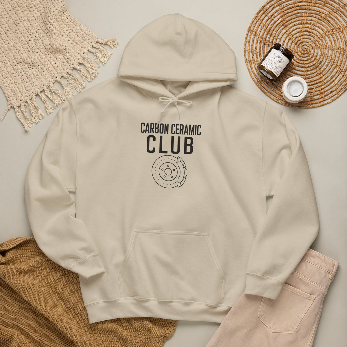 Beige hoodie with front graphic print, drawstring hood, and kangaroo pocket.