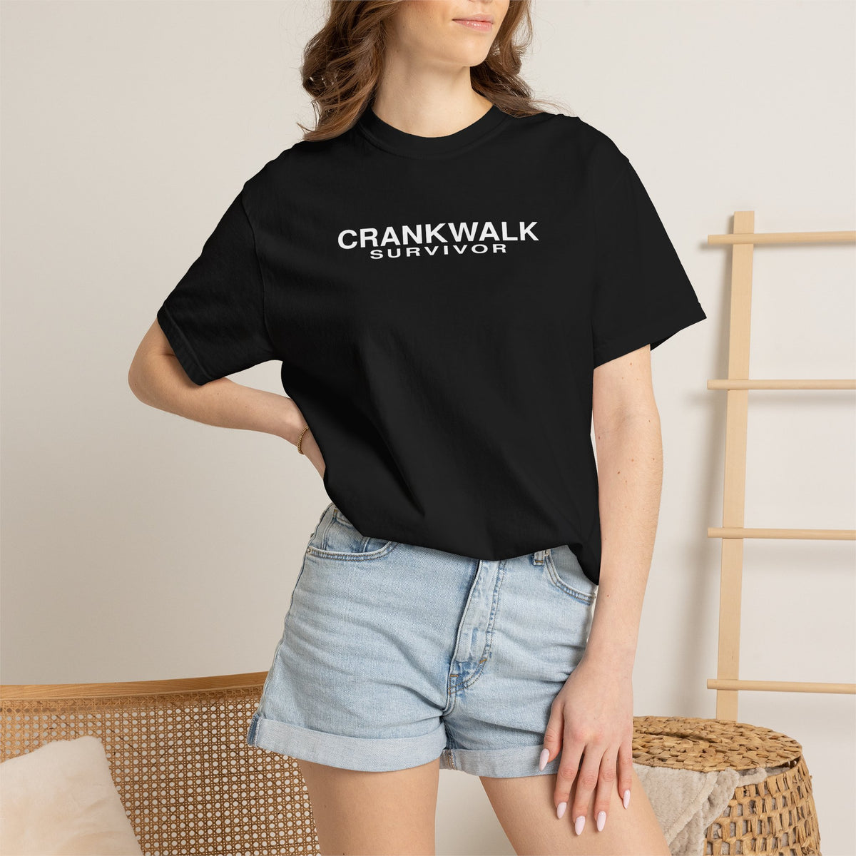 Black Crankwalk Survivor T-shirt with front logo print worn on model.