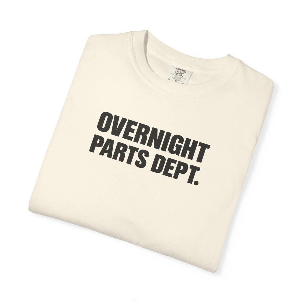 Ivory crew-neck T-shirt, folded, showing "OVERNIGHT PARTS DEPT." logo