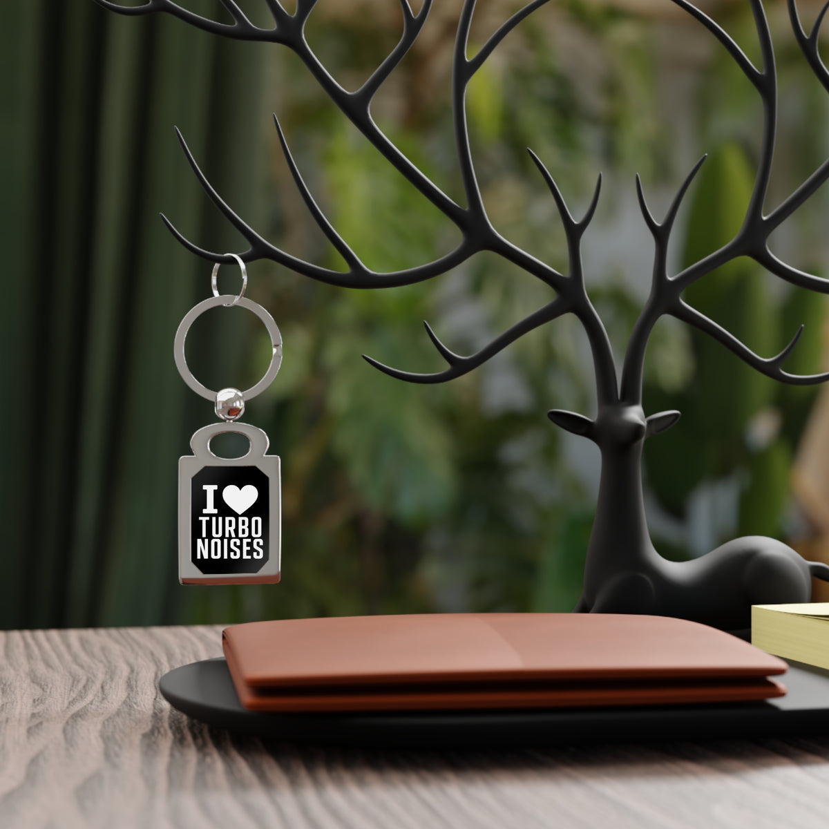 Silver keyring with black 'I ♥ TURBO NOISES' tag charm