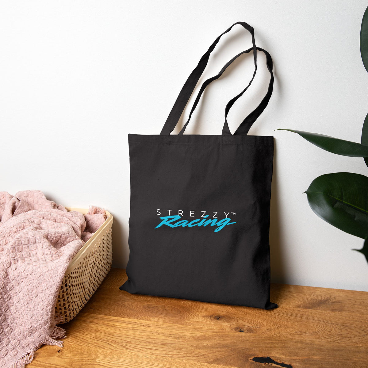 Black canvas tote bag with Strezzy Racing logo, two top handles.
