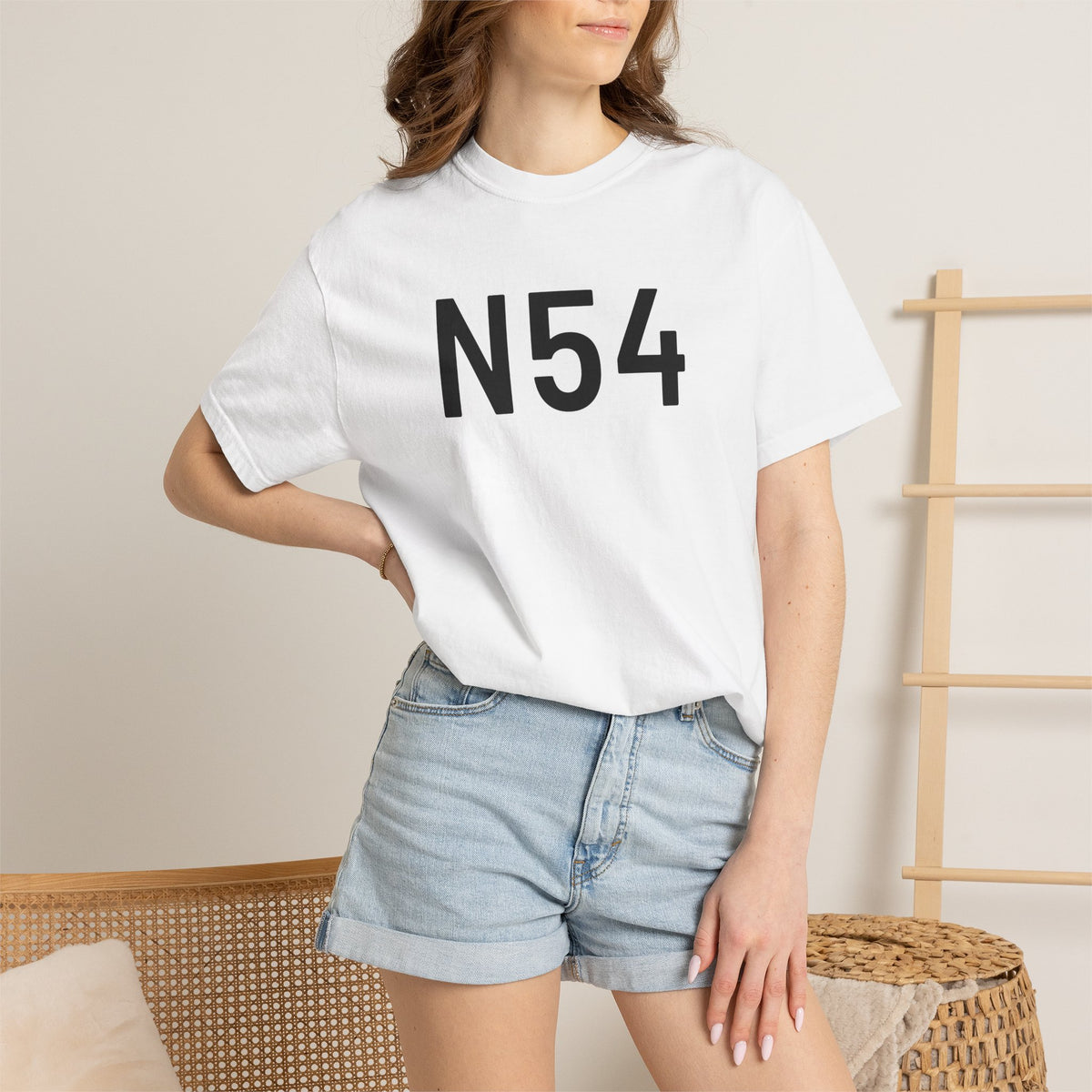 White crew-neck T-shirt with bold black “N54” graphic worn by a model