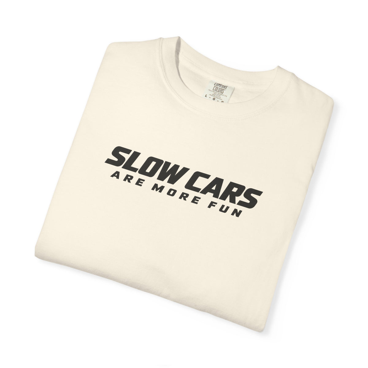 Ivory T-shirt folded with "SLOWCARS ARE MORE FUN" graphic across the front