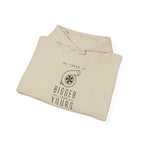 Sand pullover hoodie with front graphic and drawstring hood, folded flat
