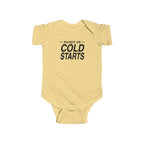 Butter yellow baby bodysuit with short sleeves and 'Cold Starts' front graphic