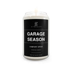 Garage Season comfort spice soy candle in clear glass jar with black label and flame