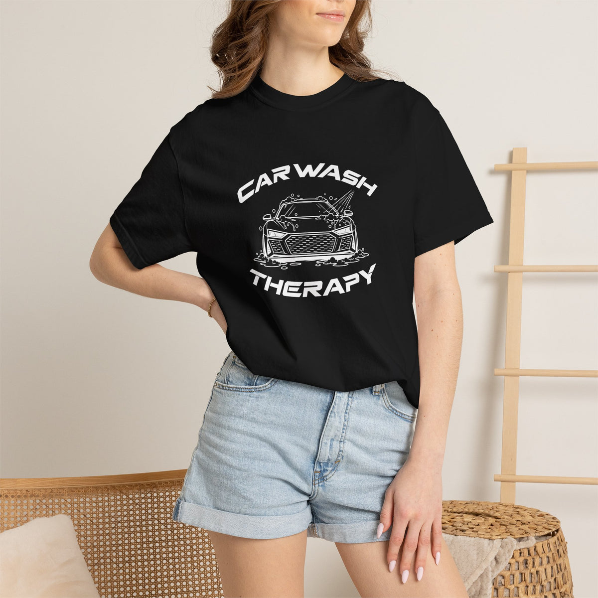 Black crew-neck T-shirt worn by model, 'CAR WASH THERAPY' front graphic