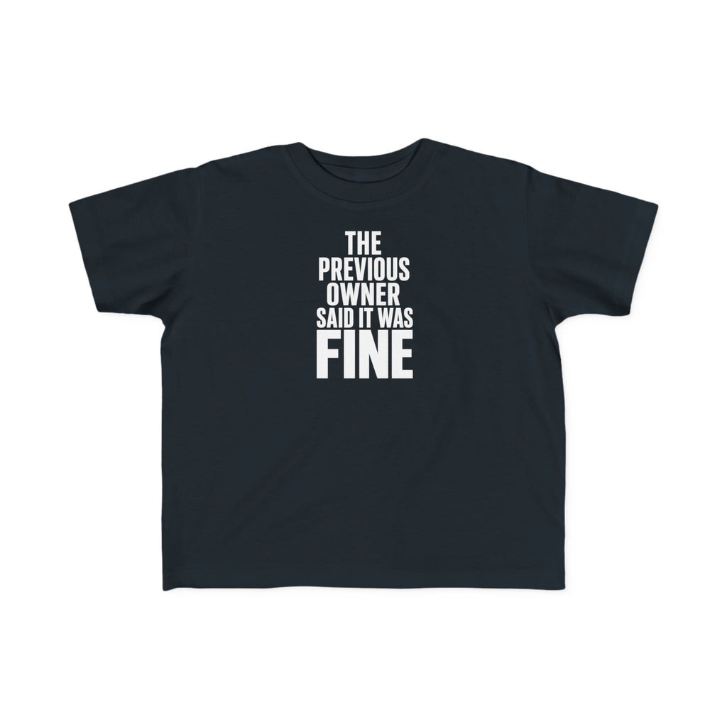 Black toddler graphic t-shirt with centered "THE PREVIOUS OWNER SAID IT WAS FINE" text
