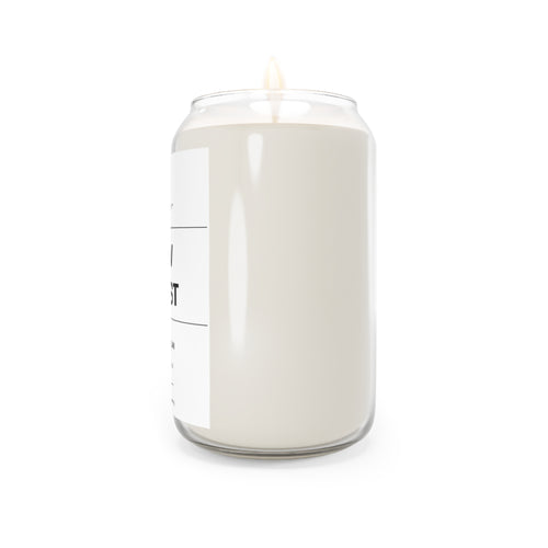 Soy candle in clear jar with flame, smooth off-white wax, side view