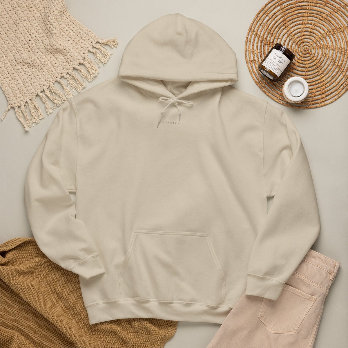 Cream pullover hoodie with front pocket and drawstring hood, long sleeves