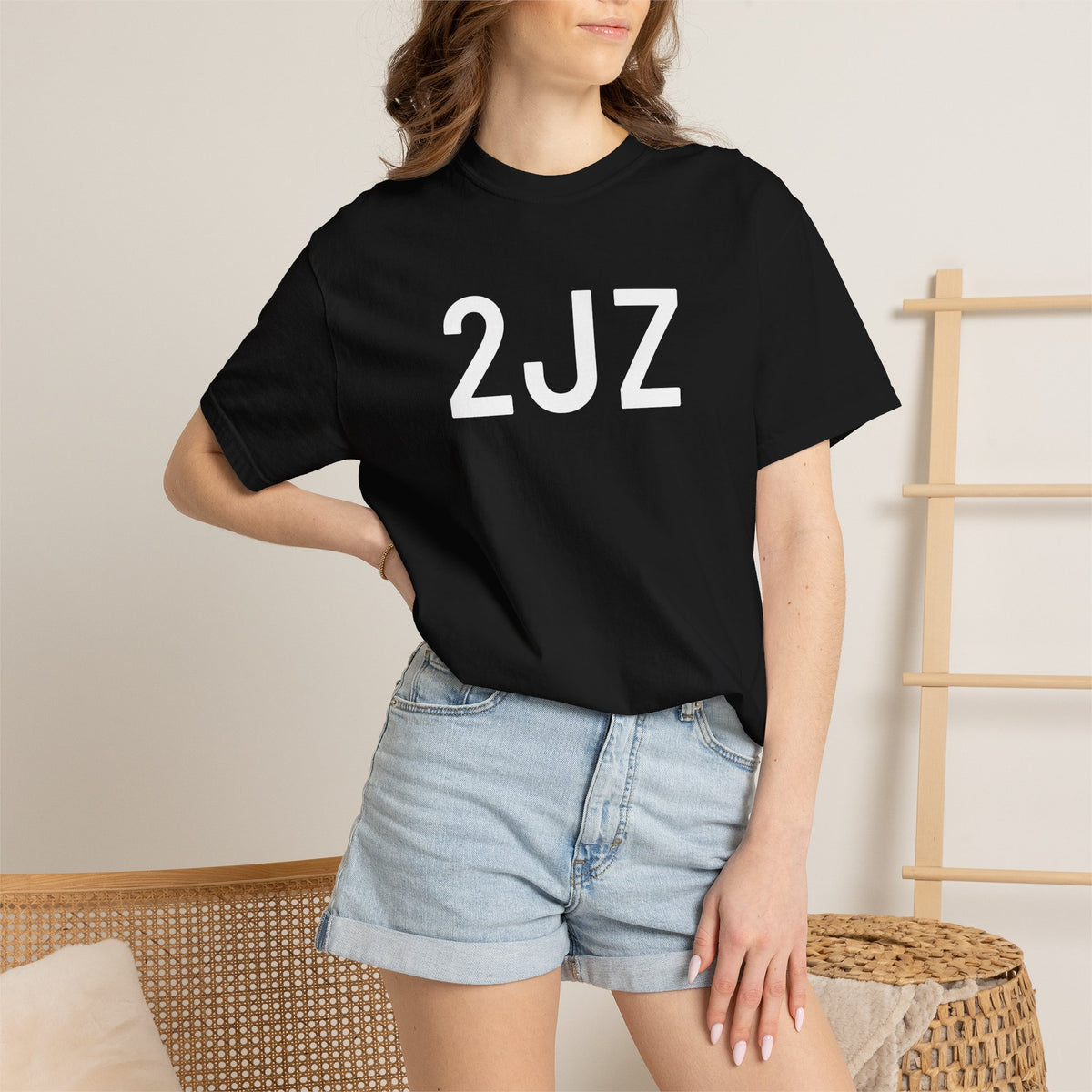 Black 2JZ graphic T-shirt worn by model, crew neck, short sleeves