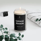 Glass jar candle with black Garage Season label, comfort spice scent, lit wick on top