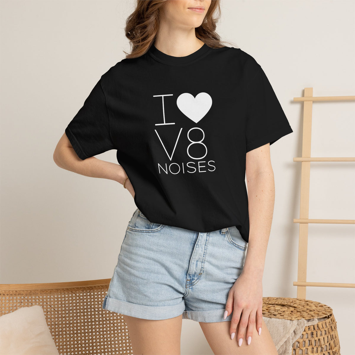 Black crewneck T-shirt with 'V8 NOISES' heart graphic, worn