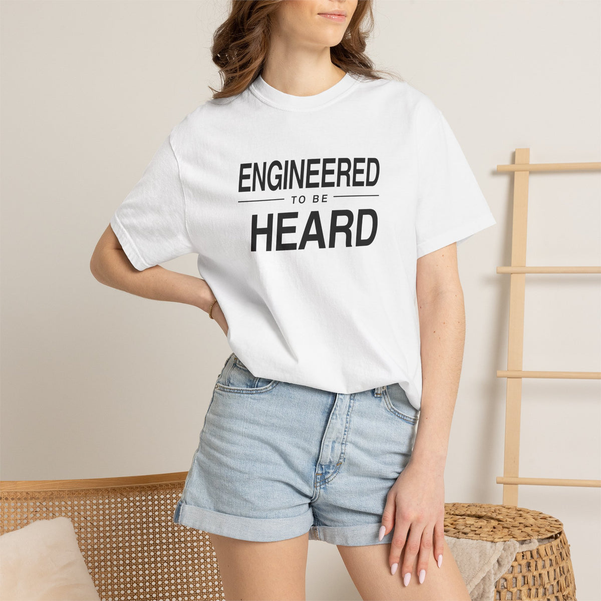 White T-shirt worn by model with 'Engineered to Be Heard' front graphic
