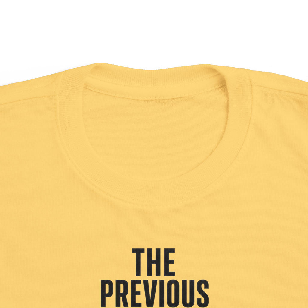 Butter yellow toddler t-shirt back close-up of text "THE PREVIOUS"
