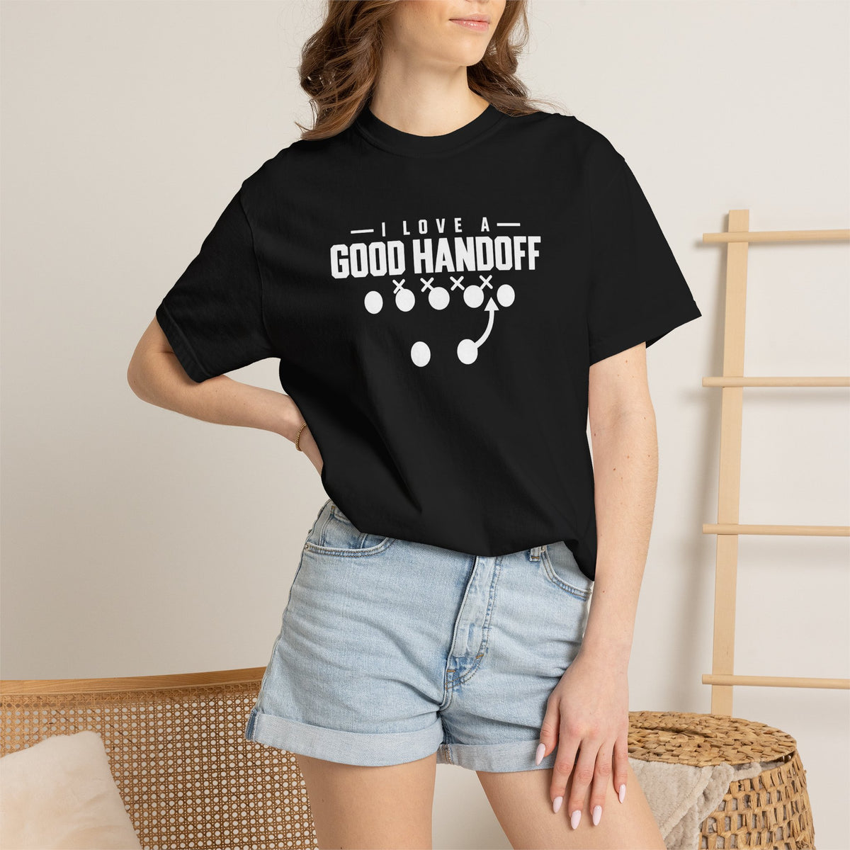 Black football t-shirt with white “I Love a Good Handoff” graphic on the front