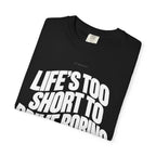 Black short-sleeve T-shirt laid flat with front slogan graphic