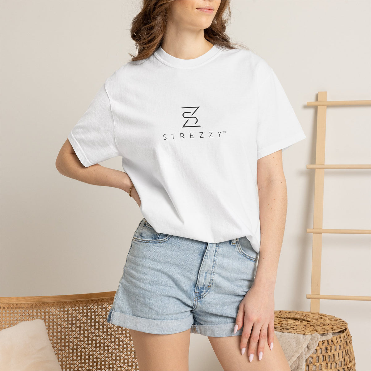 White logo T-shirt worn by model, crew neck and short sleeves