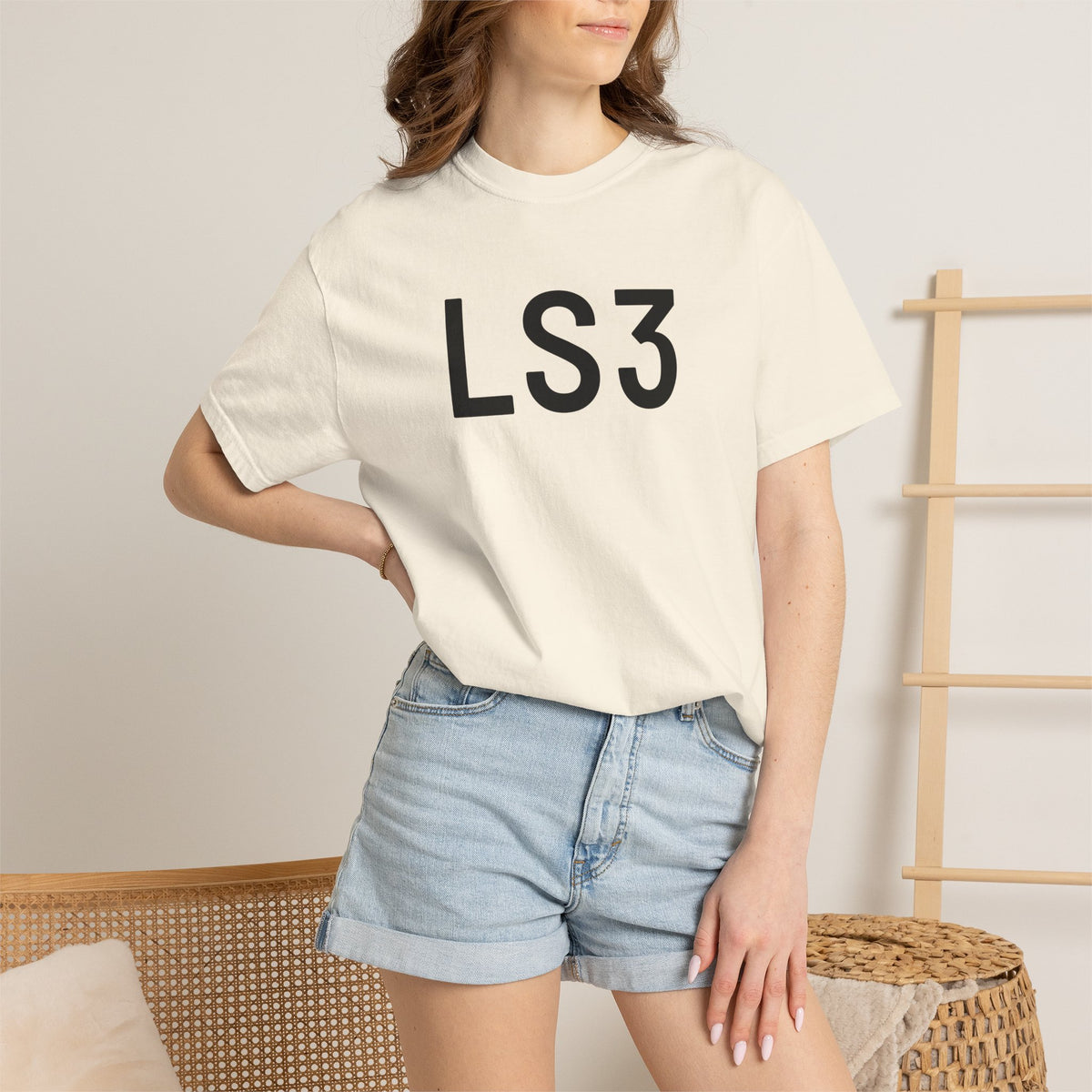 Off-white crewneck T-shirt with black “LS3” logo print on the front (worn)