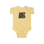 Butter yellow baby bodysuit with short sleeves and "DAILY DRIVER" front graphic