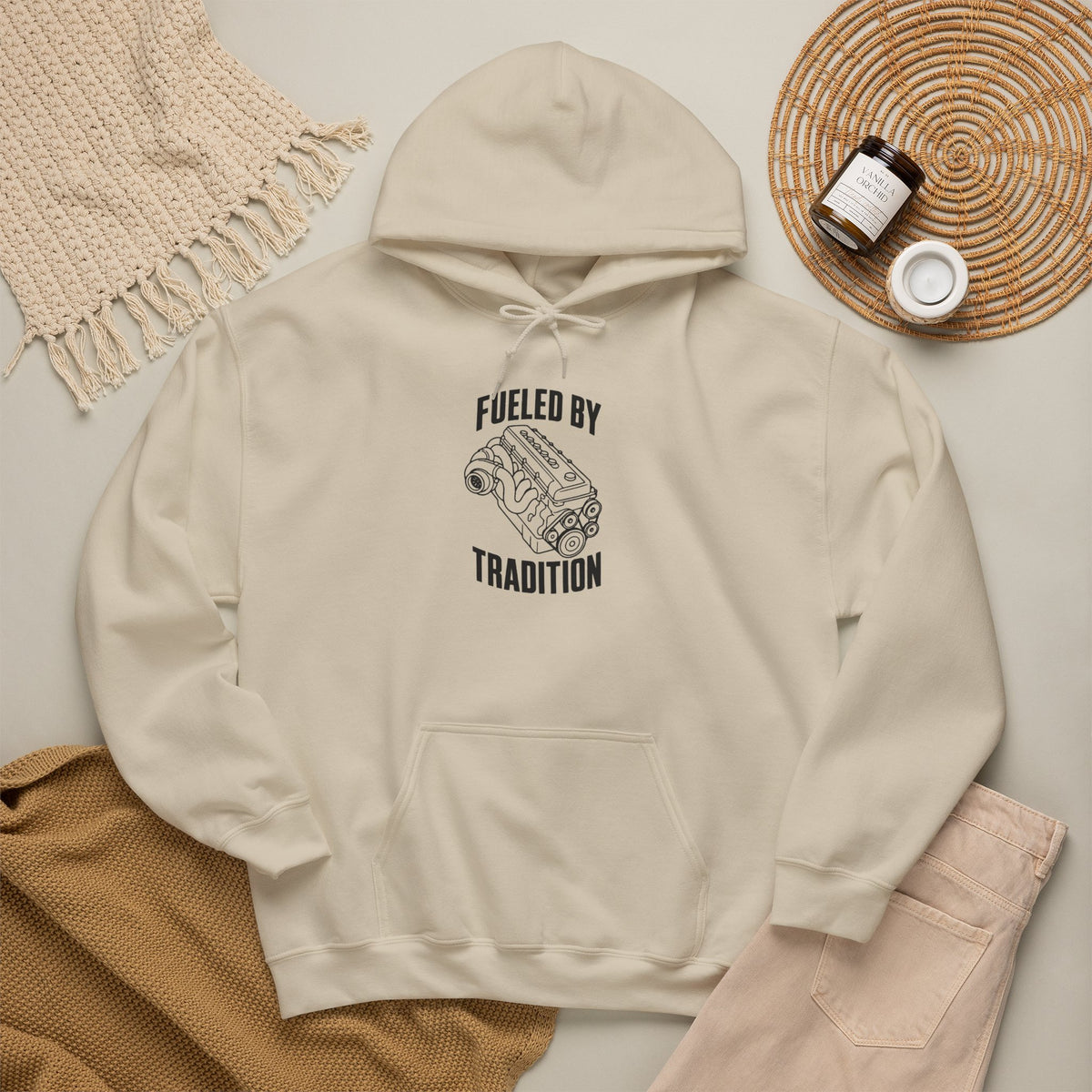 Sand pullover hoodie with “Fueled by Tradition” inline engine graphic, front pocket and hood