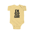 Butter yellow baby bodysuit with "I'm just here for the candy" graphic on the front