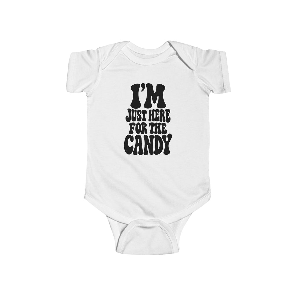 White baby bodysuit with "I'm just here for the candy" graphic on the front